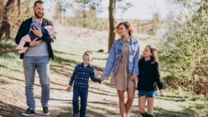 Big family with kids together in the forest